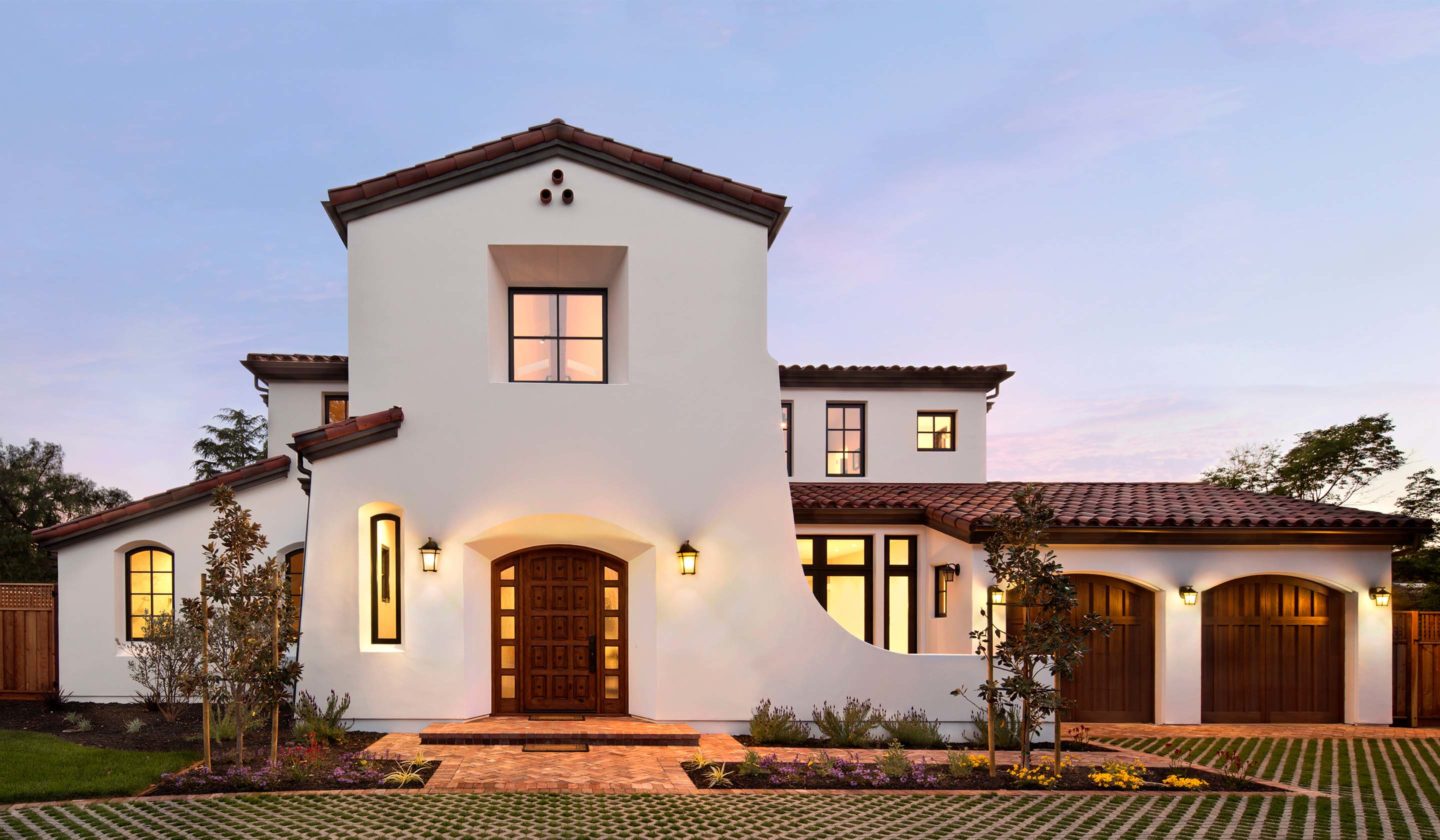 front view of mission-style home exterior with garage