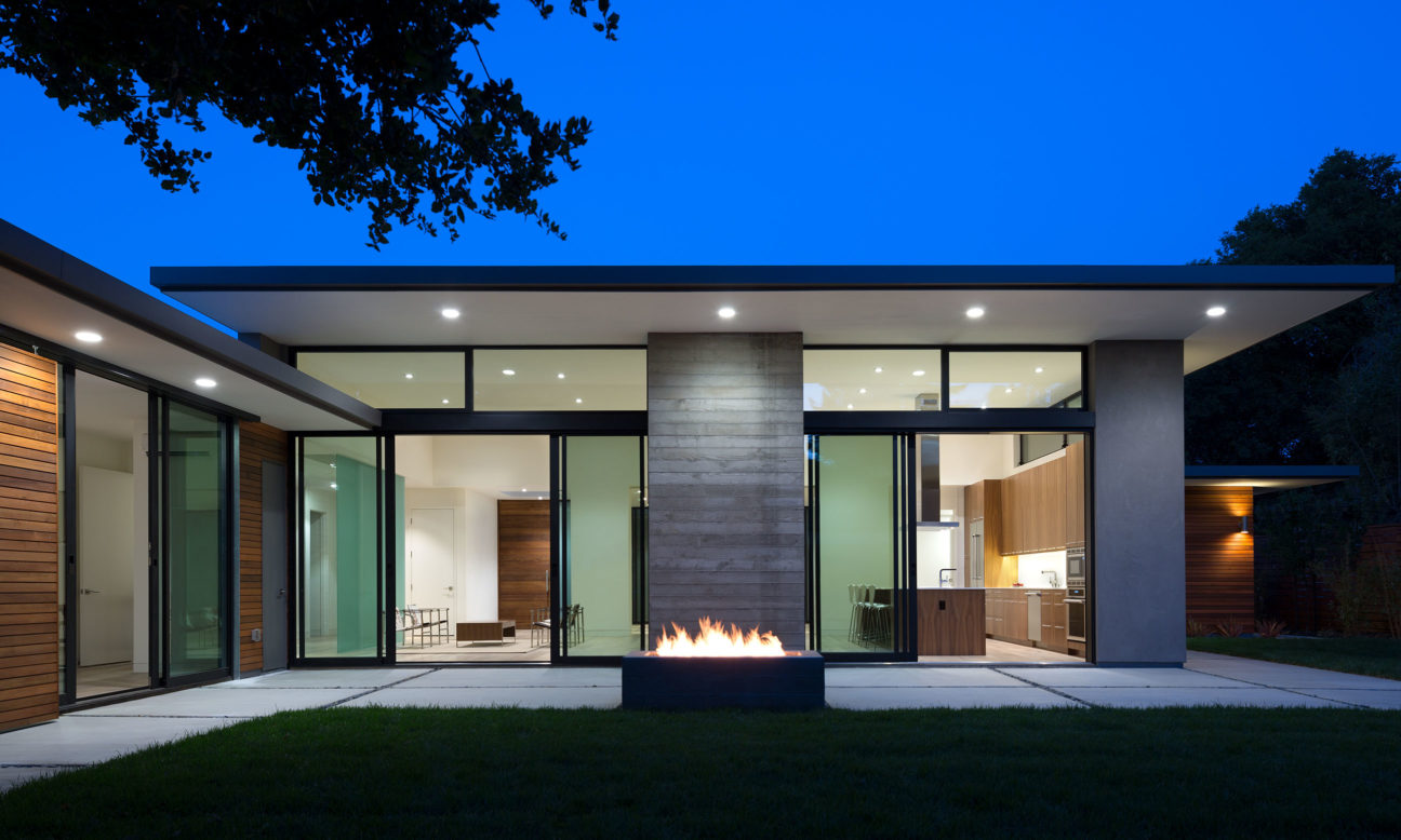 night photo of Los Altos home exterior and fire pit
