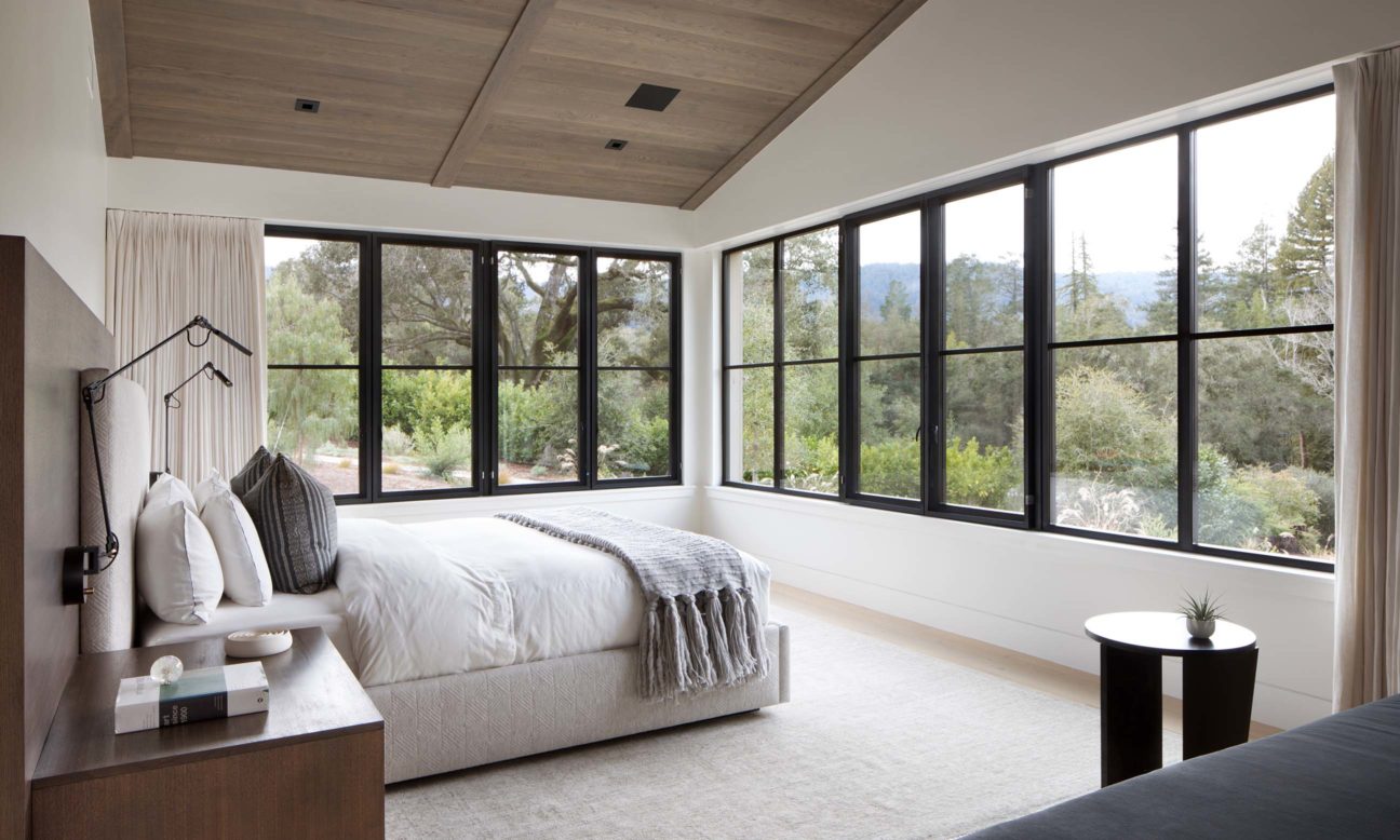 bright bedroom with nature views in modern farmhouse